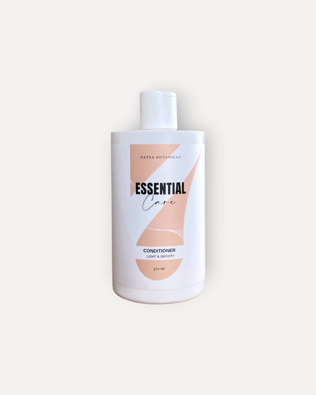 Bottle of Patea Botanica Essential Care conditioner on a white background