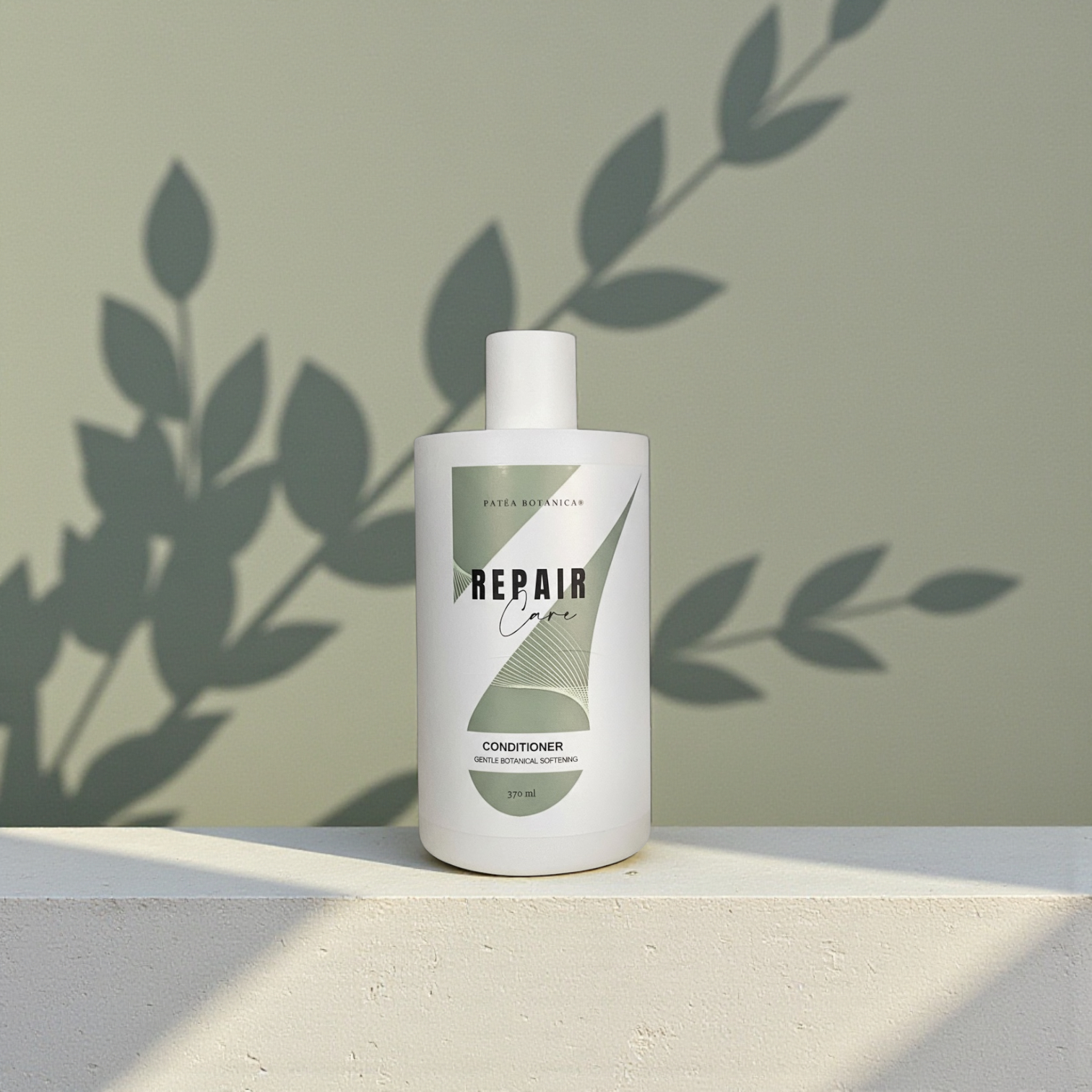 White bottle of 'Repair Care' conditioner on a light surface with a green leafy background